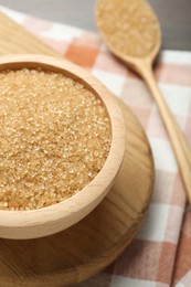 Photo of Brown sugar in bowl on table, closeup