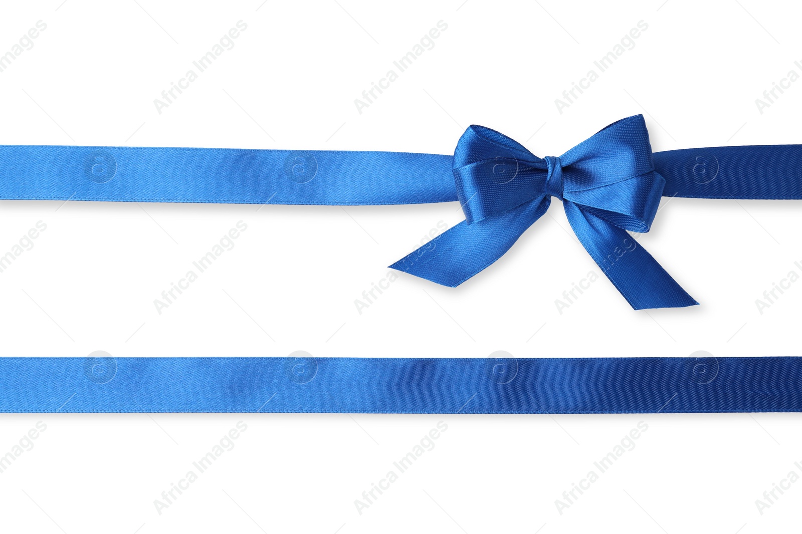 Photo of Blue satin ribbons with bow on white background, top view