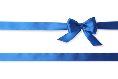 Blue satin ribbons with bow on white background, top view