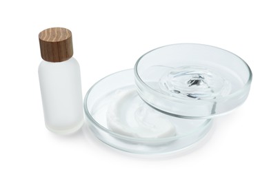 Petri dishes and cosmetic products on white background