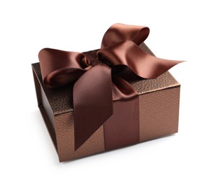 Photo of Brown gift box decorated with satin ribbon and bow on white background