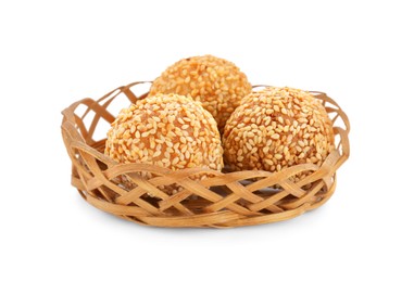 Photo of Wicker basket of delicious sesame balls on white background