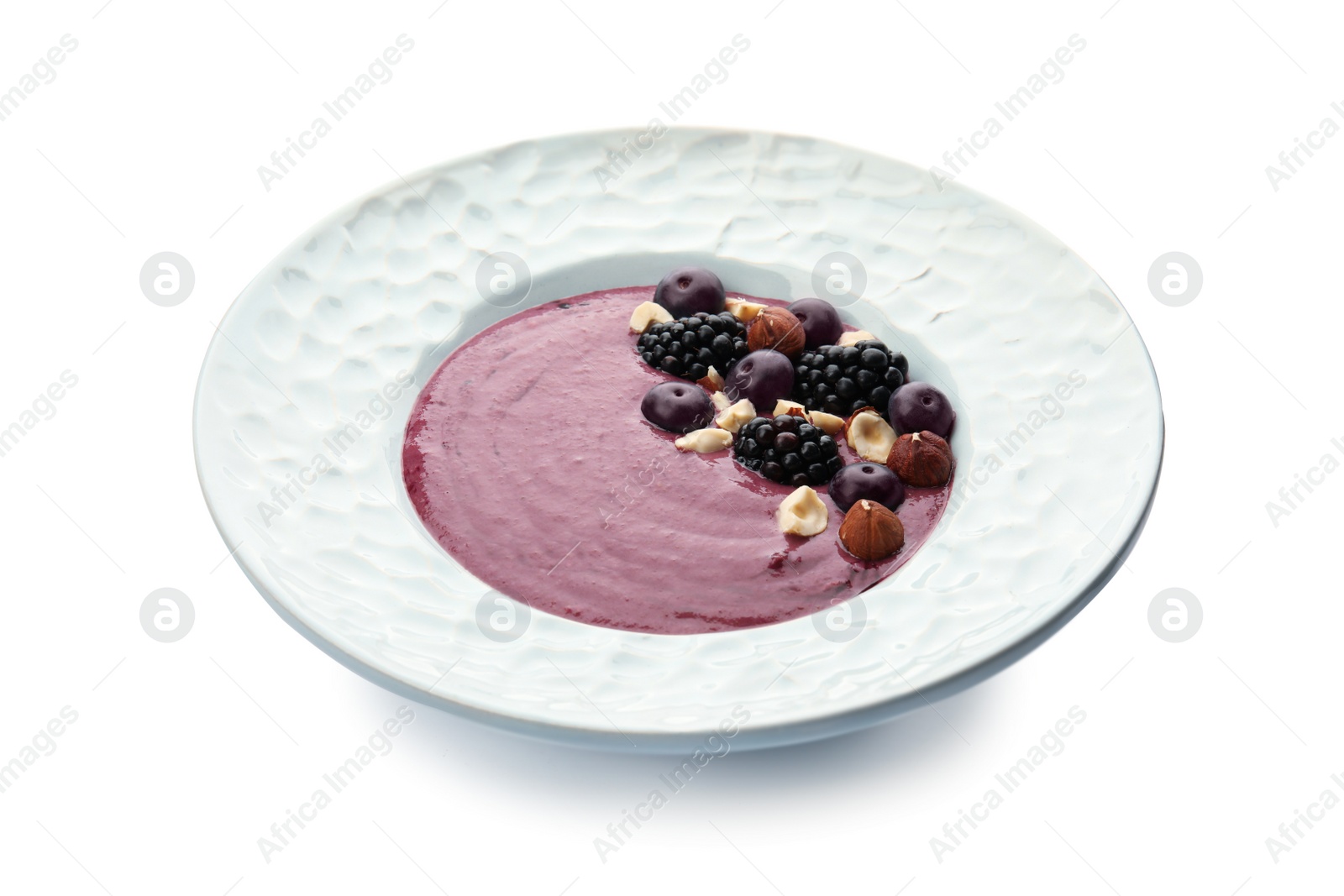 Photo of Plate with tasty acai smoothie on white background