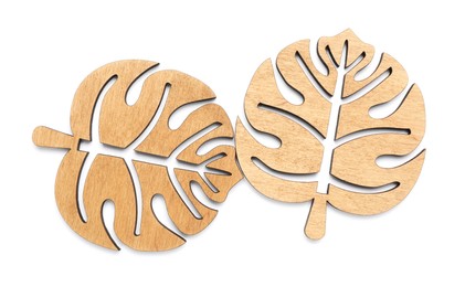 Leaf shaped wooden cup coasters on white background, top view