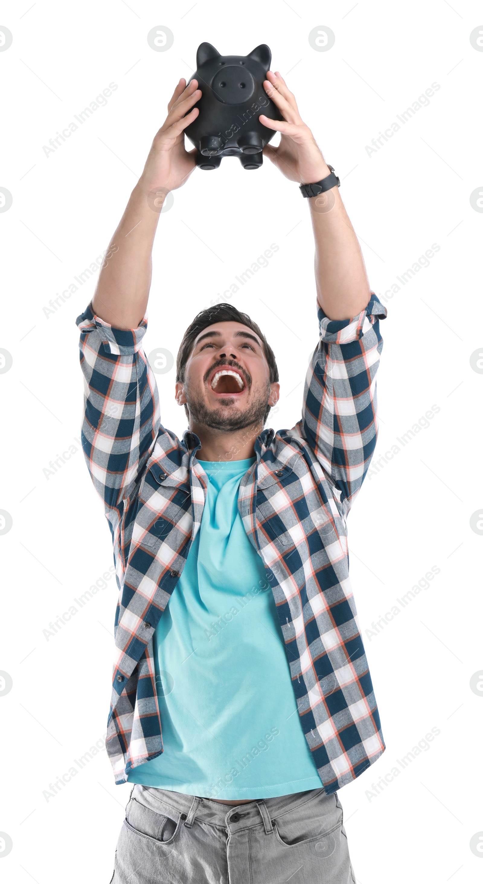 Photo of Handsome young man with piggy bank on white background