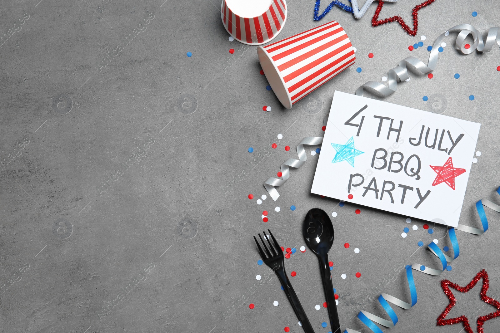 Photo of Flat lay composition with dishware and card on color background, space for text. USA Independence Day