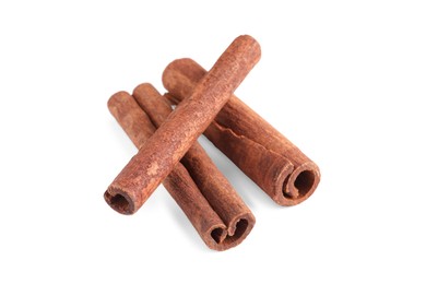 Photo of Three aromatic cinnamon sticks isolated on white