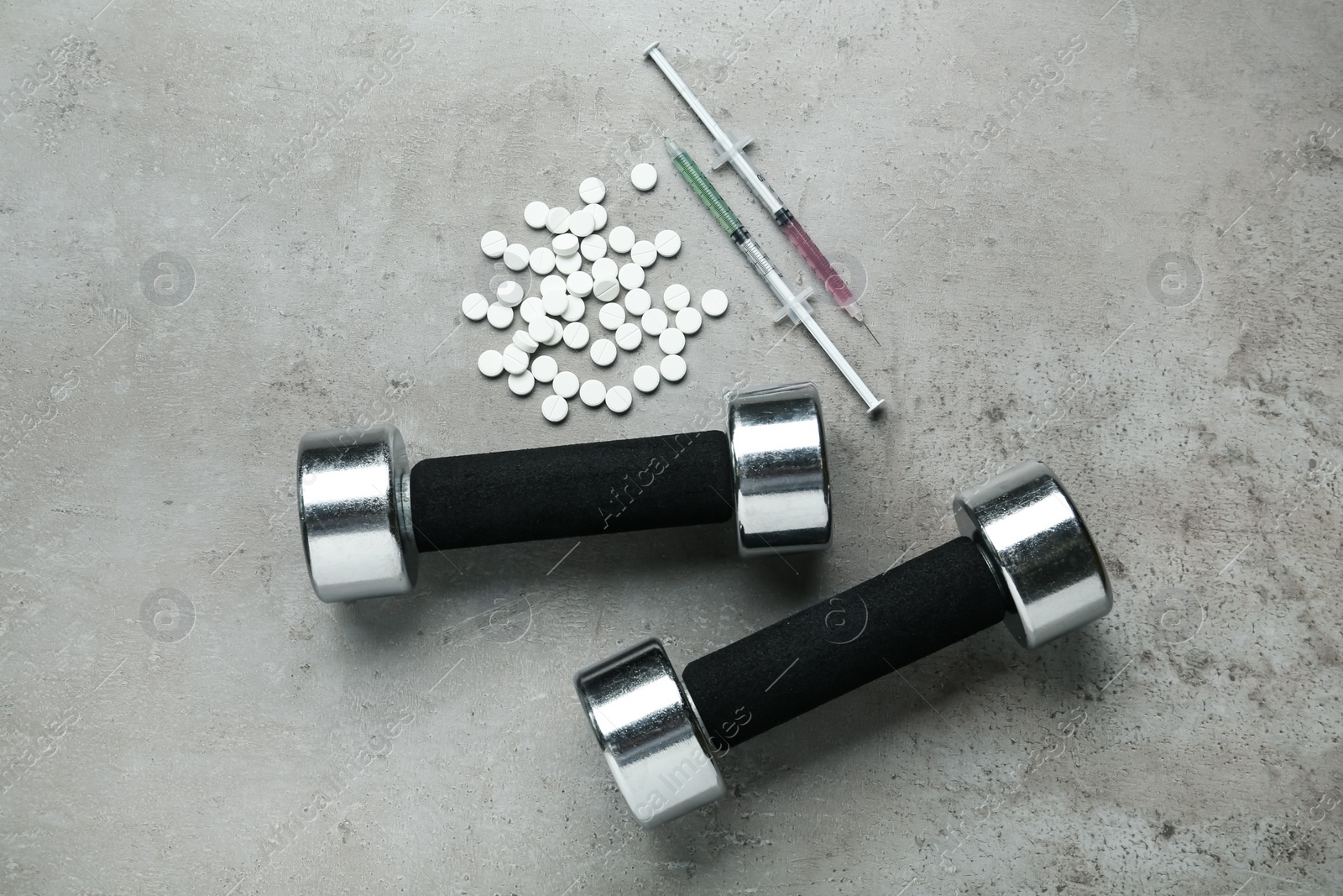 Photo of Different drugs and sports equipment on grey background, flat lay. Doping control