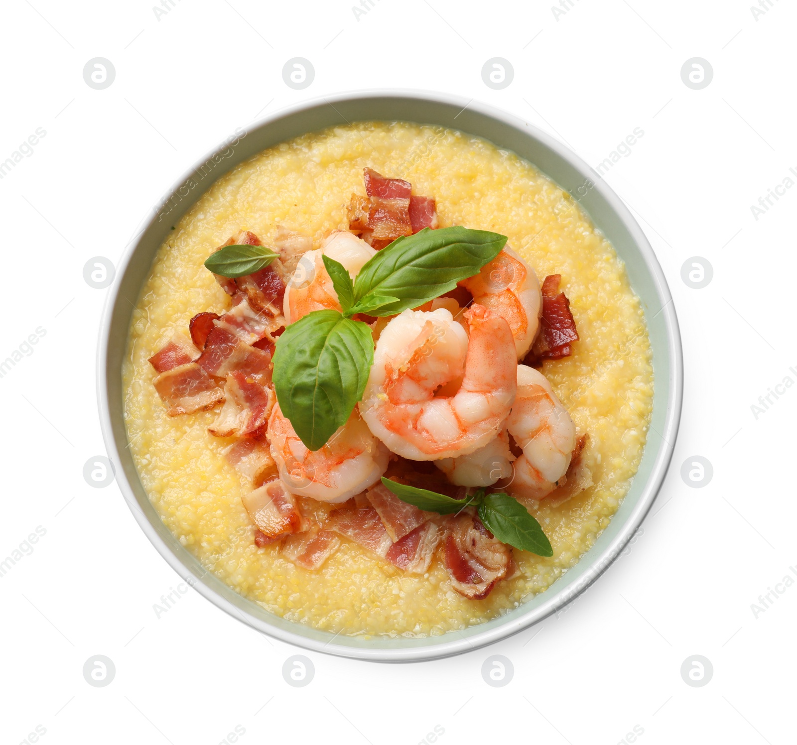 Photo of Fresh tasty shrimps, bacon, grits and basil in bowl isolated on white, top view