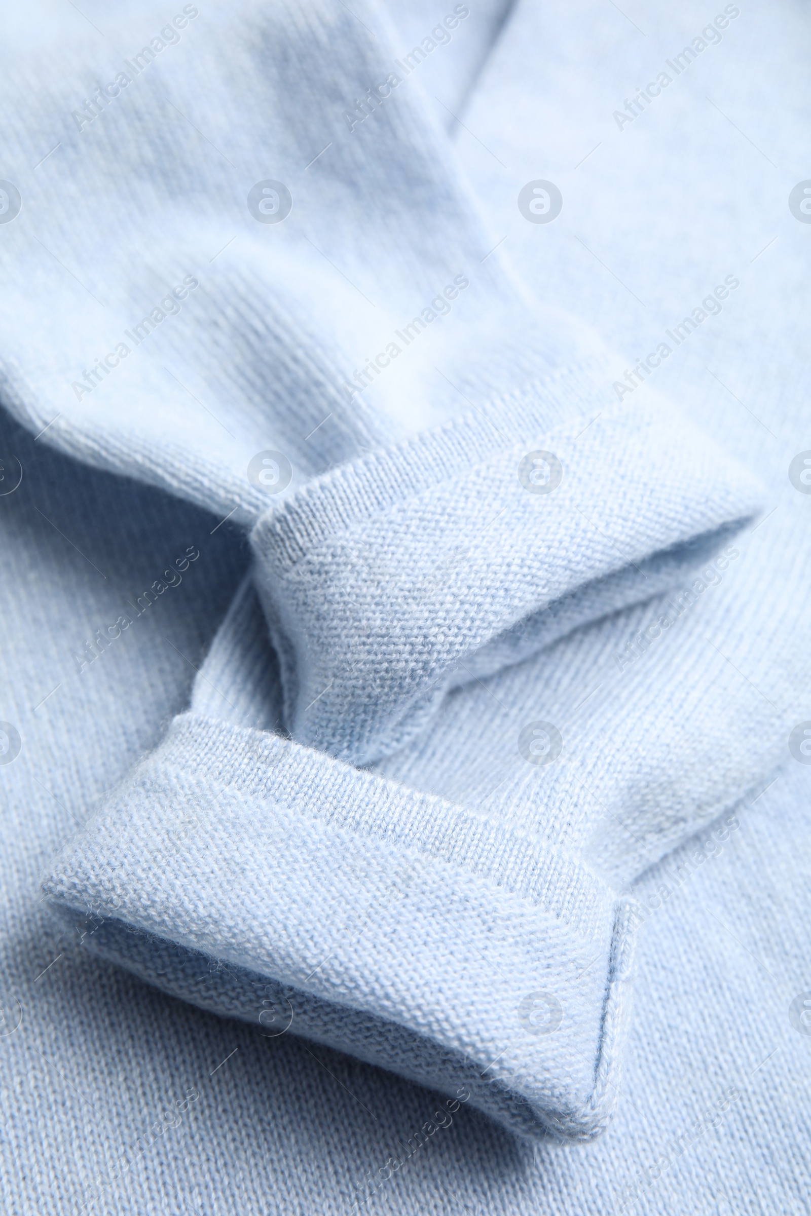 Photo of Warm cashmere sweater as background, closeup view