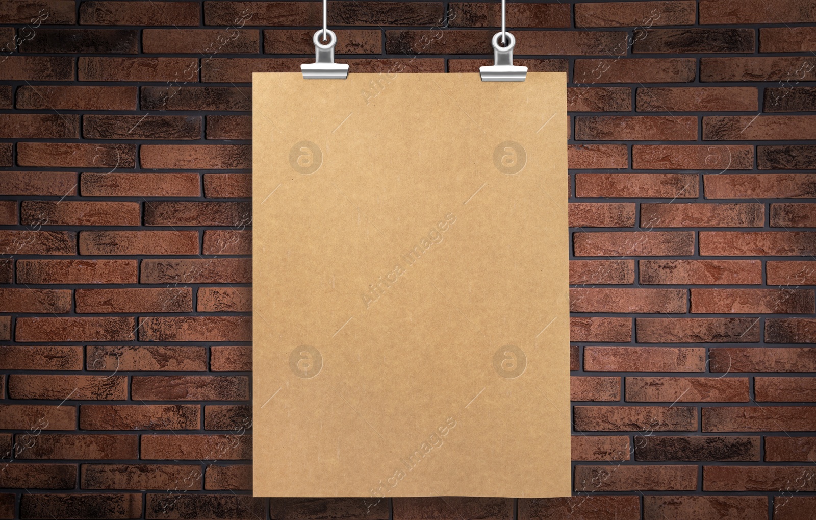 Image of Blank poster hanging near brick wall. Space for design