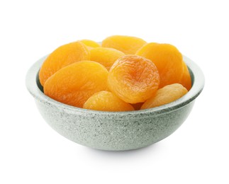 Photo of Ceramic bowl with tasty dried apricots isolated on white