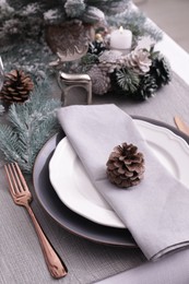 Luxury place setting with beautiful festive decor for Christmas dinner on white table