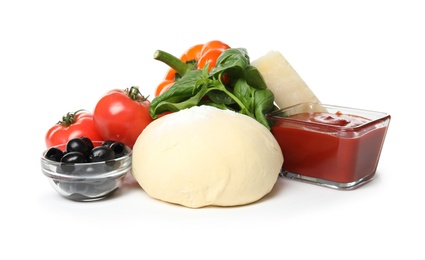 Composition with dough and fresh ingredients for pizza isolated on white
