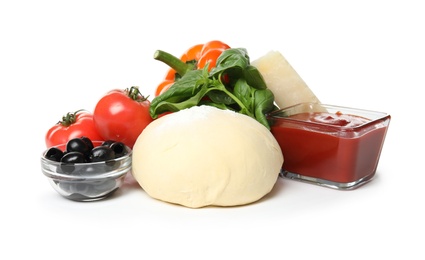 Photo of Composition with dough and fresh ingredients for pizza isolated on white