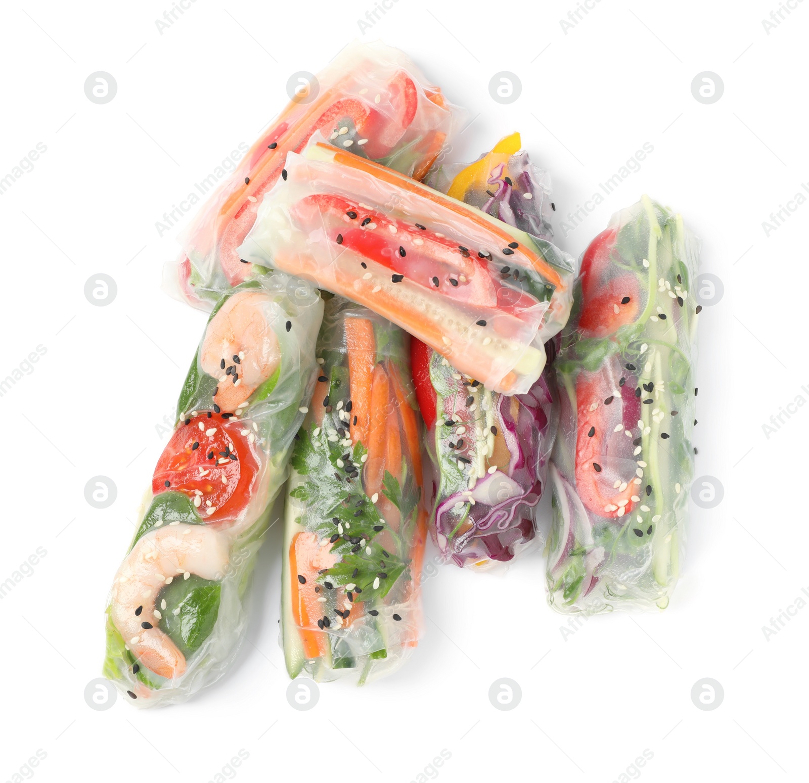 Photo of Many different rolls wrapped in rice paper on white background, top view
