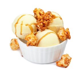 Photo of Delicious ice cream with caramel popcorn and sauce in dessert bowl on white background