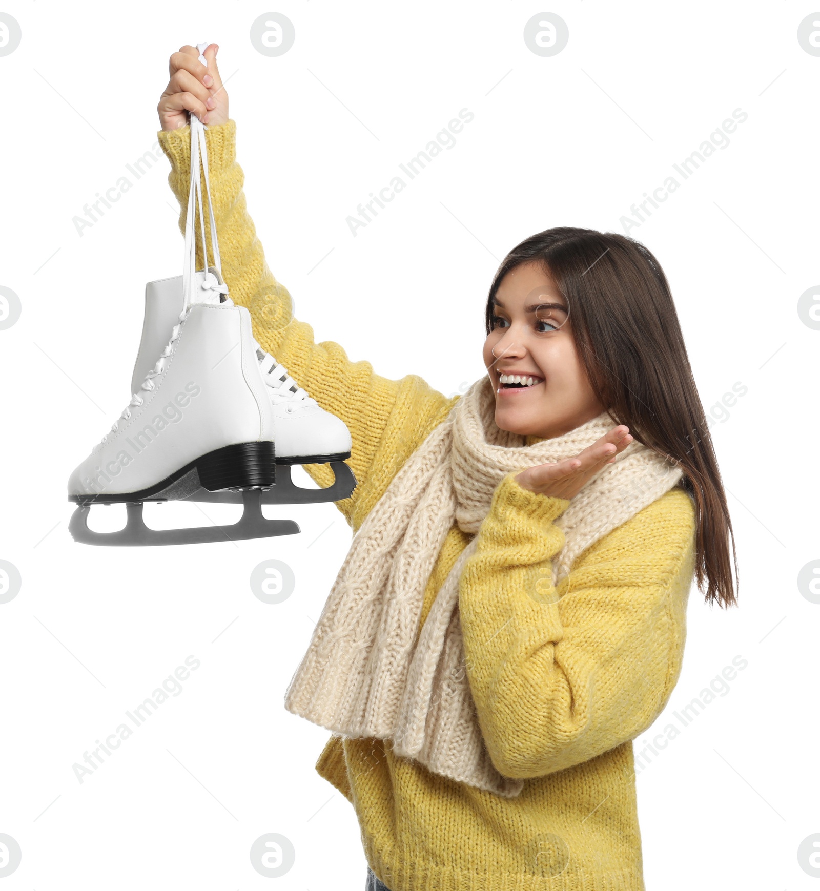 Photo of Emotional woman with ice skates on white background