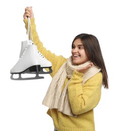 Emotional woman with ice skates on white background