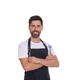 Photo of Smiling hairdresser holding scissors on white background