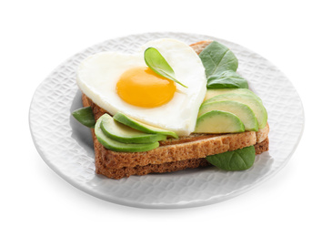 Photo of Plate of tasty breakfast with heart shaped fried egg isolated on white