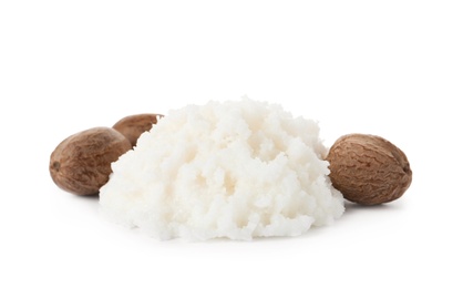 Pile of shea butter and nuts on white background