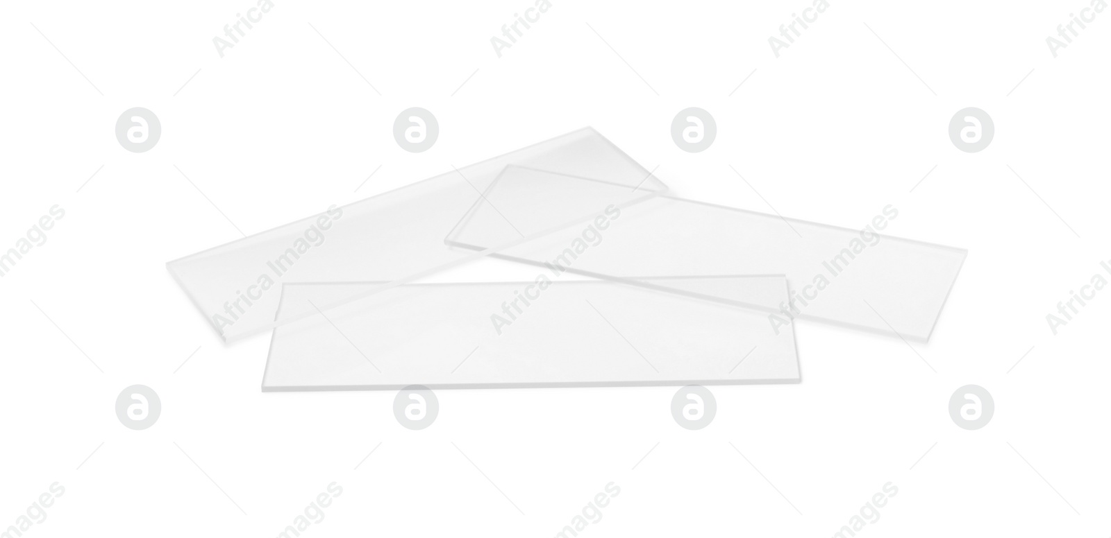 Photo of Clean glass microscope slides on white background