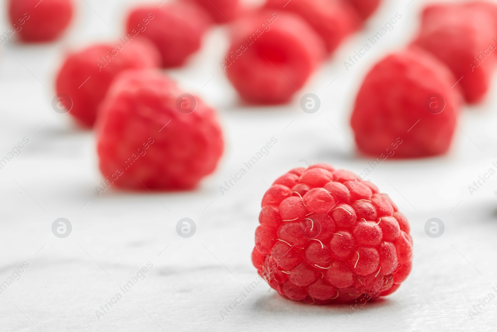 Photo of Ripe aromatic raspberries on table, closeup