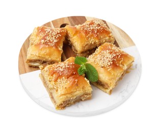 Photo of Eastern sweets. Pieces of tasty baklava isolated on white