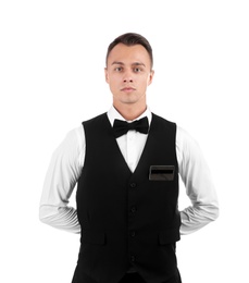 Photo of Portrait of young waiter in uniform on white background