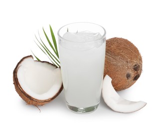 Photo of Glass of coconut water, leaf, ice cubes and nuts isolated on white