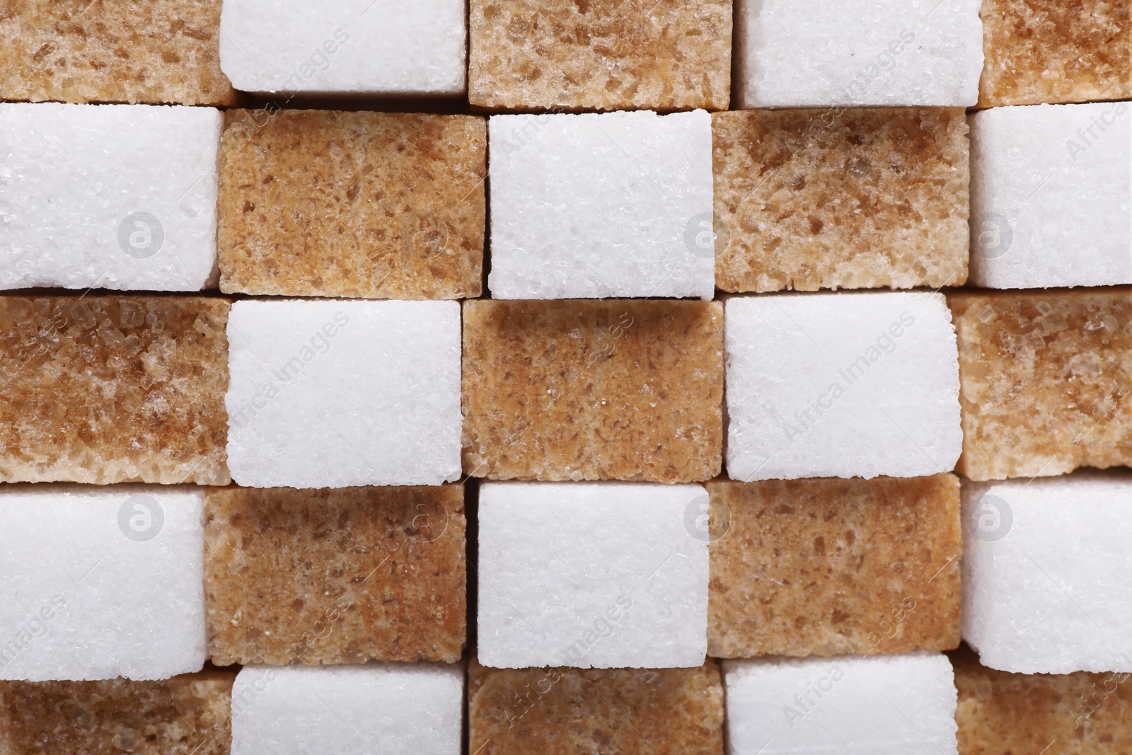 Photo of White and brown sugar cubes as background, top view