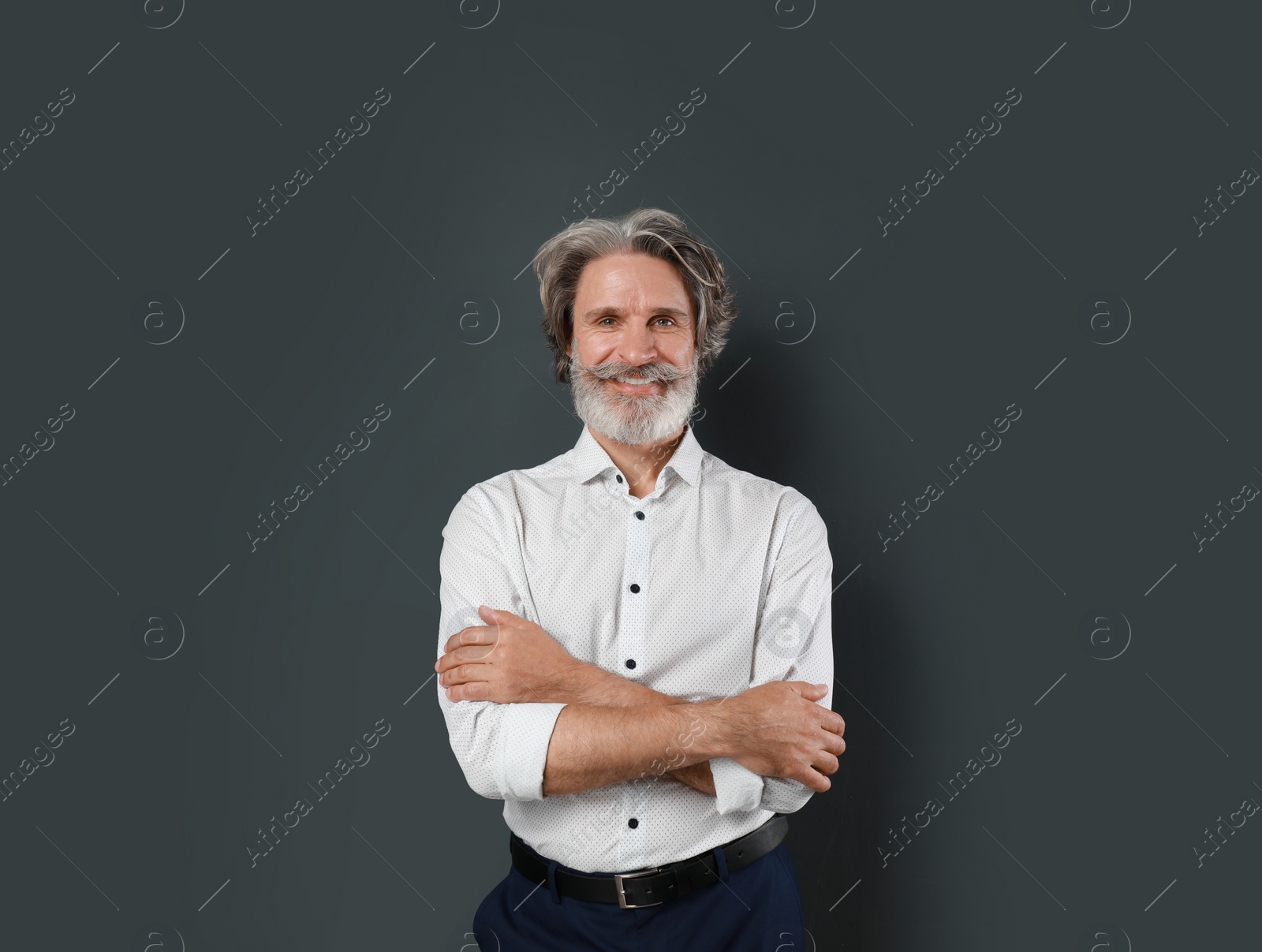 Photo of Portrait of handsome mature man on dark background