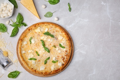 Flat lay composition with delicious pizza and ingredients on table