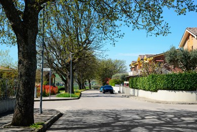 Picturesque view of beautiful suburban street on sunny spring day