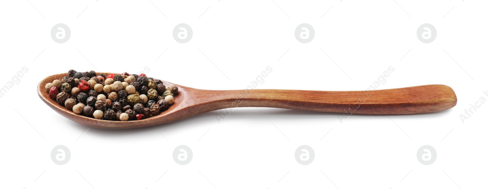 Photo of Aromatic spices. Different peppers in wooden spoon isolated on white