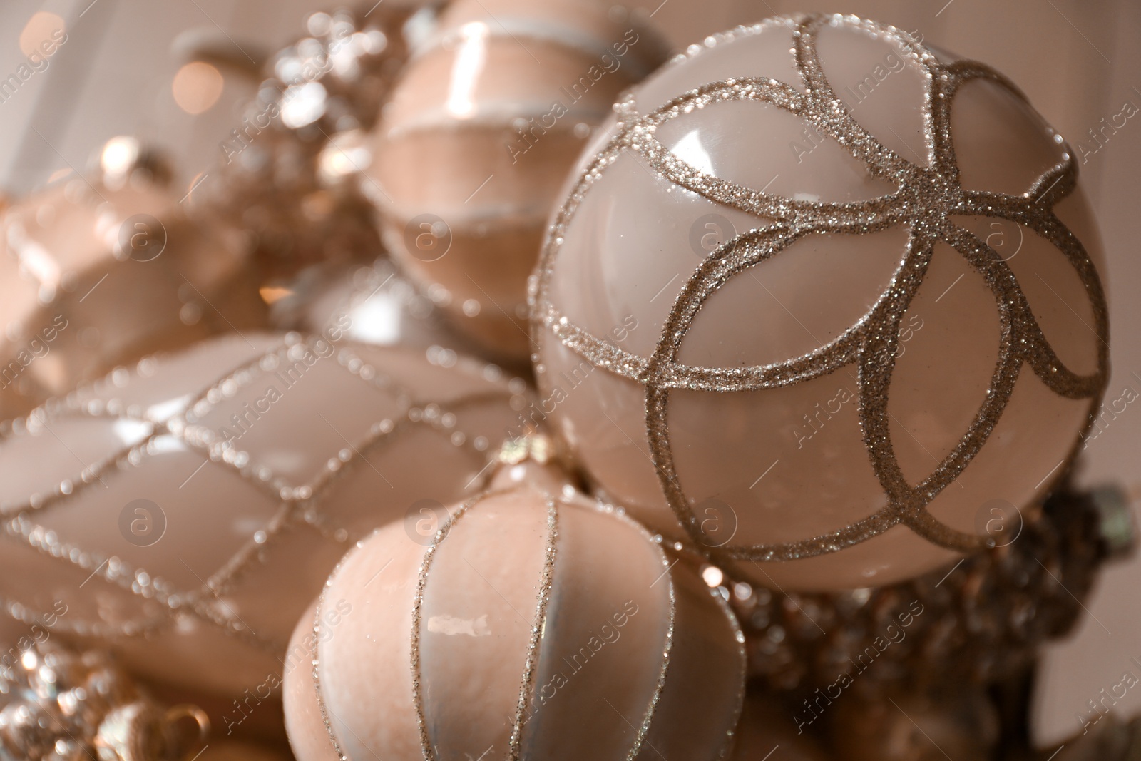 Photo of Collection of beautiful Christmas tree baubles on blurred background, closeup