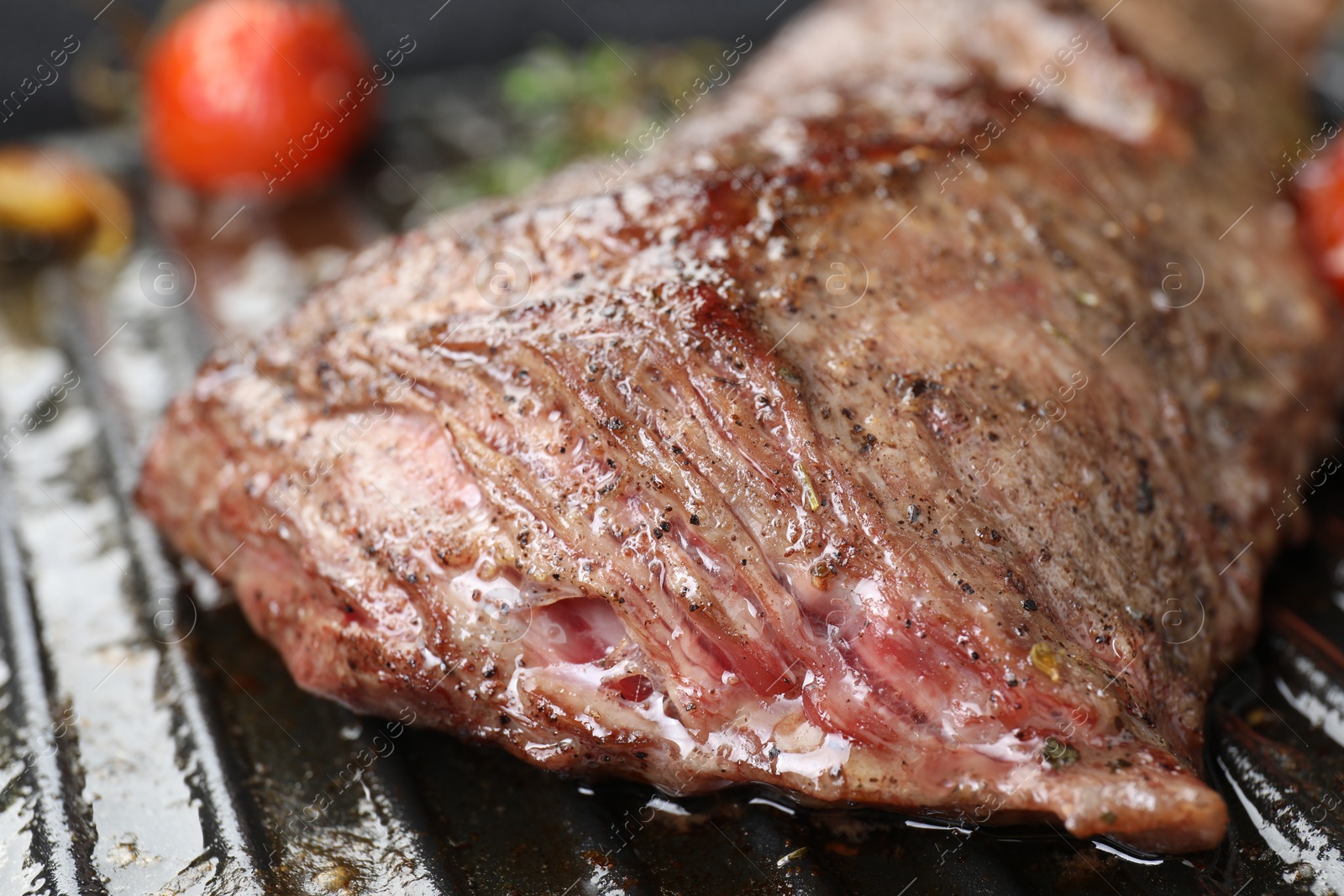 Photo of Delicious grilled beef meat in pan, closeup