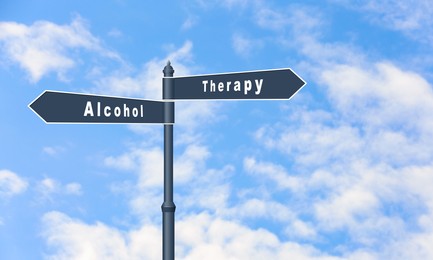 Image of Alcohol addiction: what to choose - therapy or life with bad habit? Signpost with different directions against beautiful blue sky