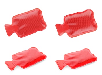 Image of Set with red rubber hot water bottles on white background