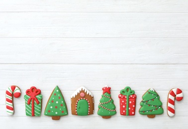 Photo of Many different delicious Christmas cookies on white wooden table, flat lay. Space for text