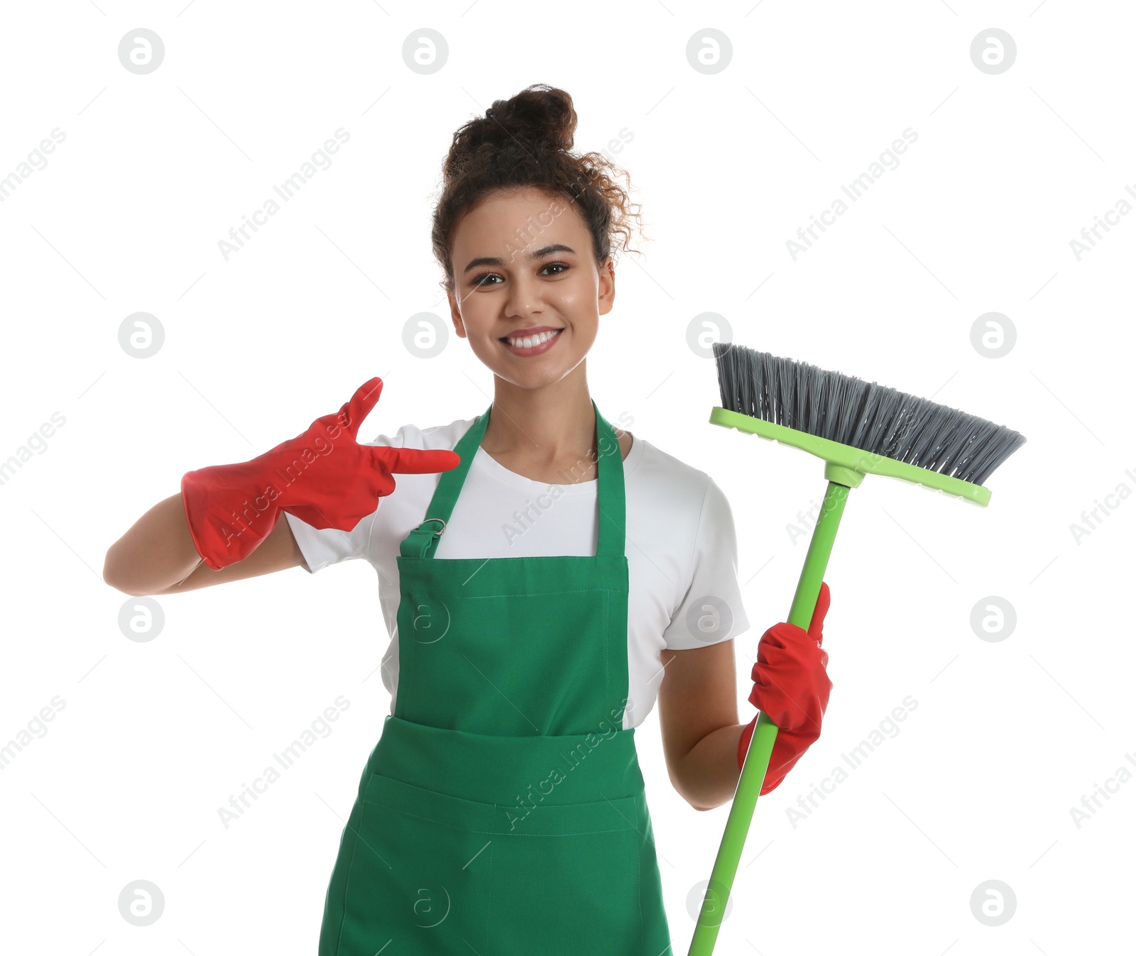 Photo of African American woman with green broom on white background