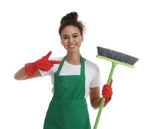 African American woman with green broom on white background