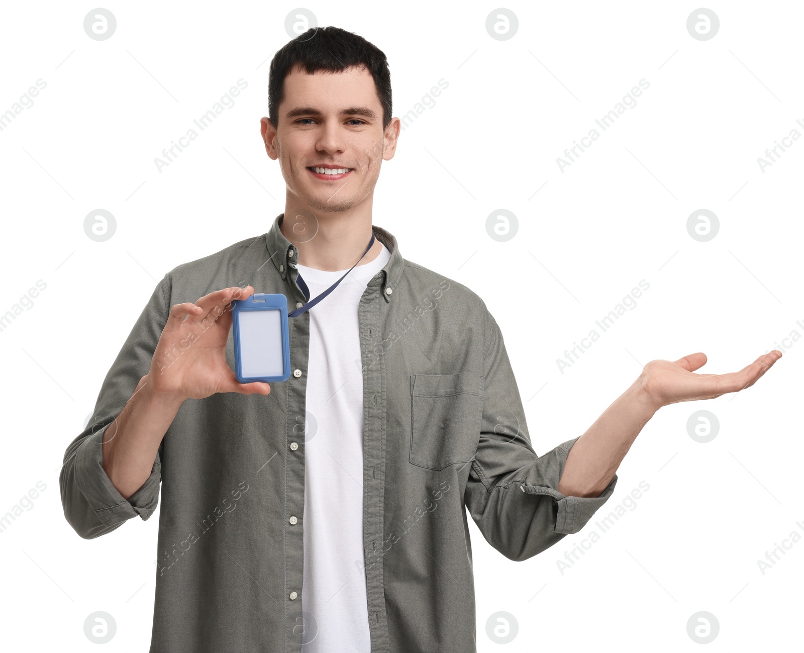 Photo of Smiling man with empty badge showing something on white background