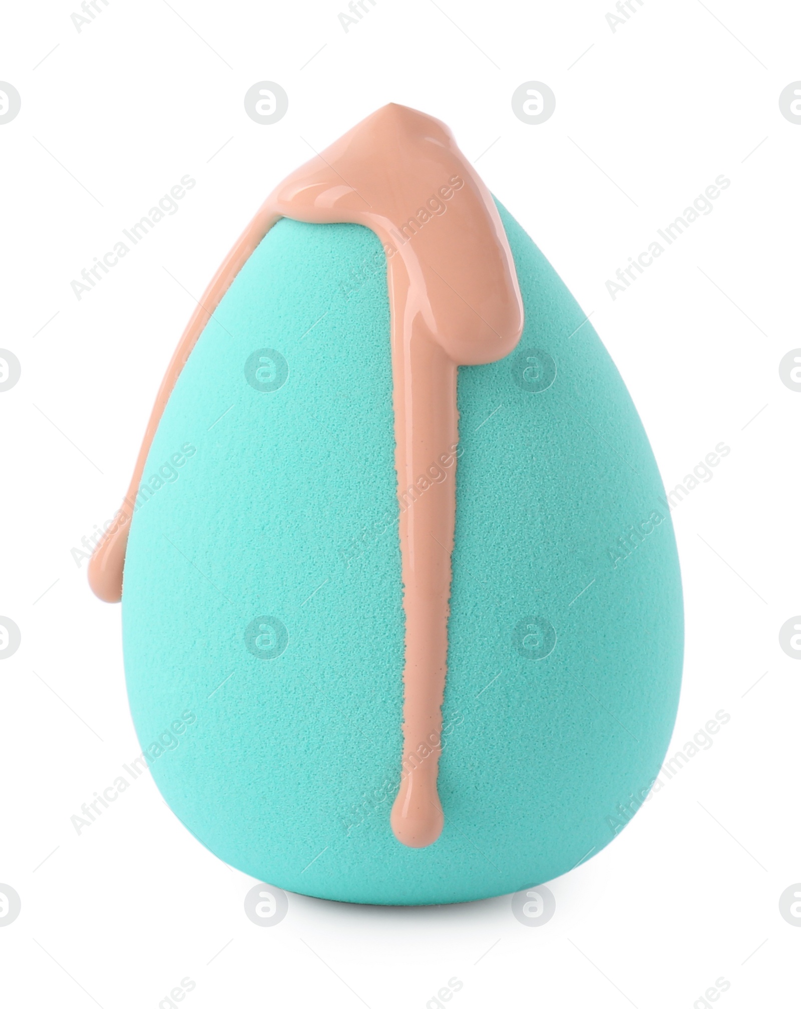 Photo of Turquoise makeup sponge with skin foundation isolated on white