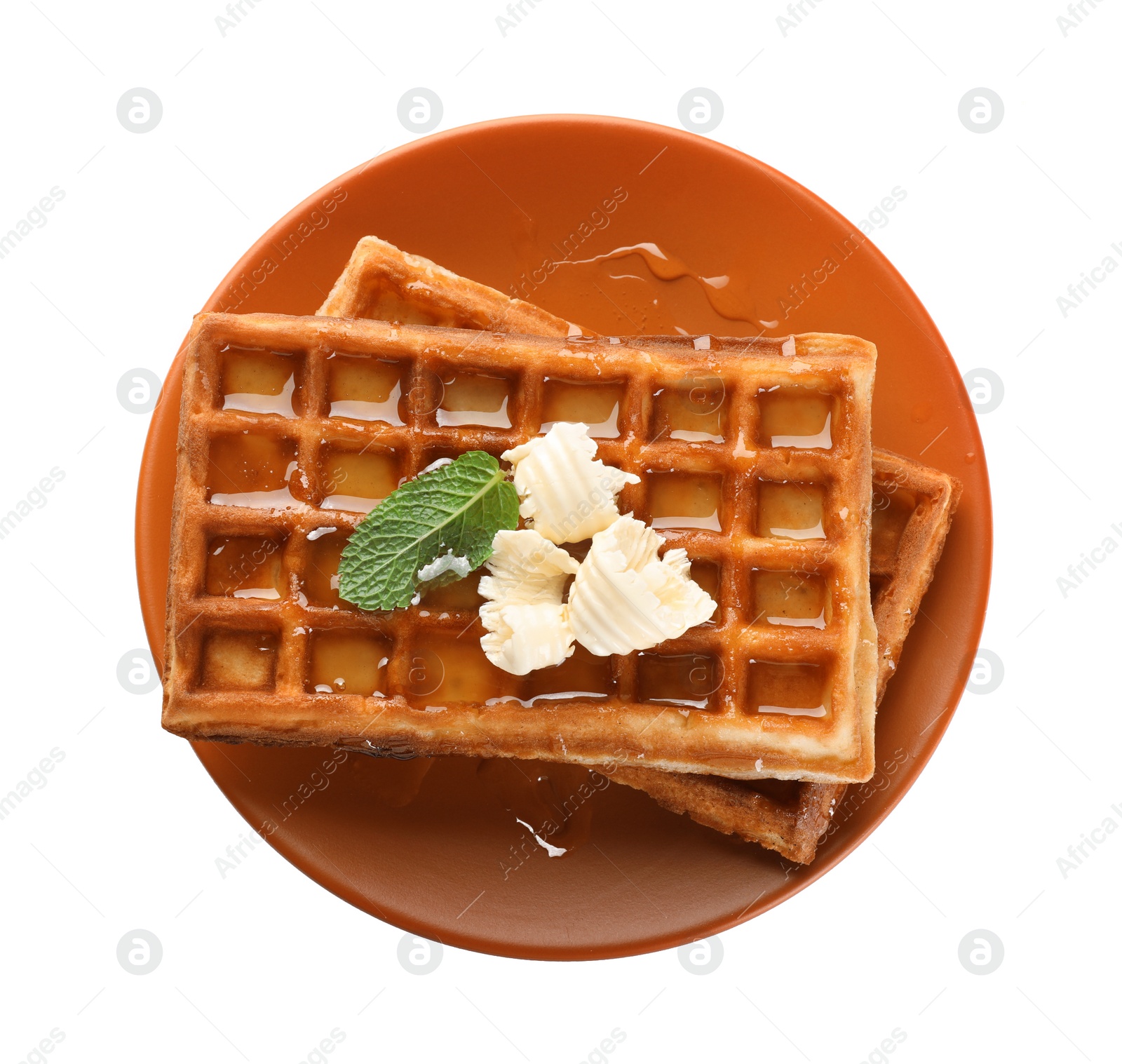 Photo of Delicious Belgian waffles with honey, mint and butter on white background, top view