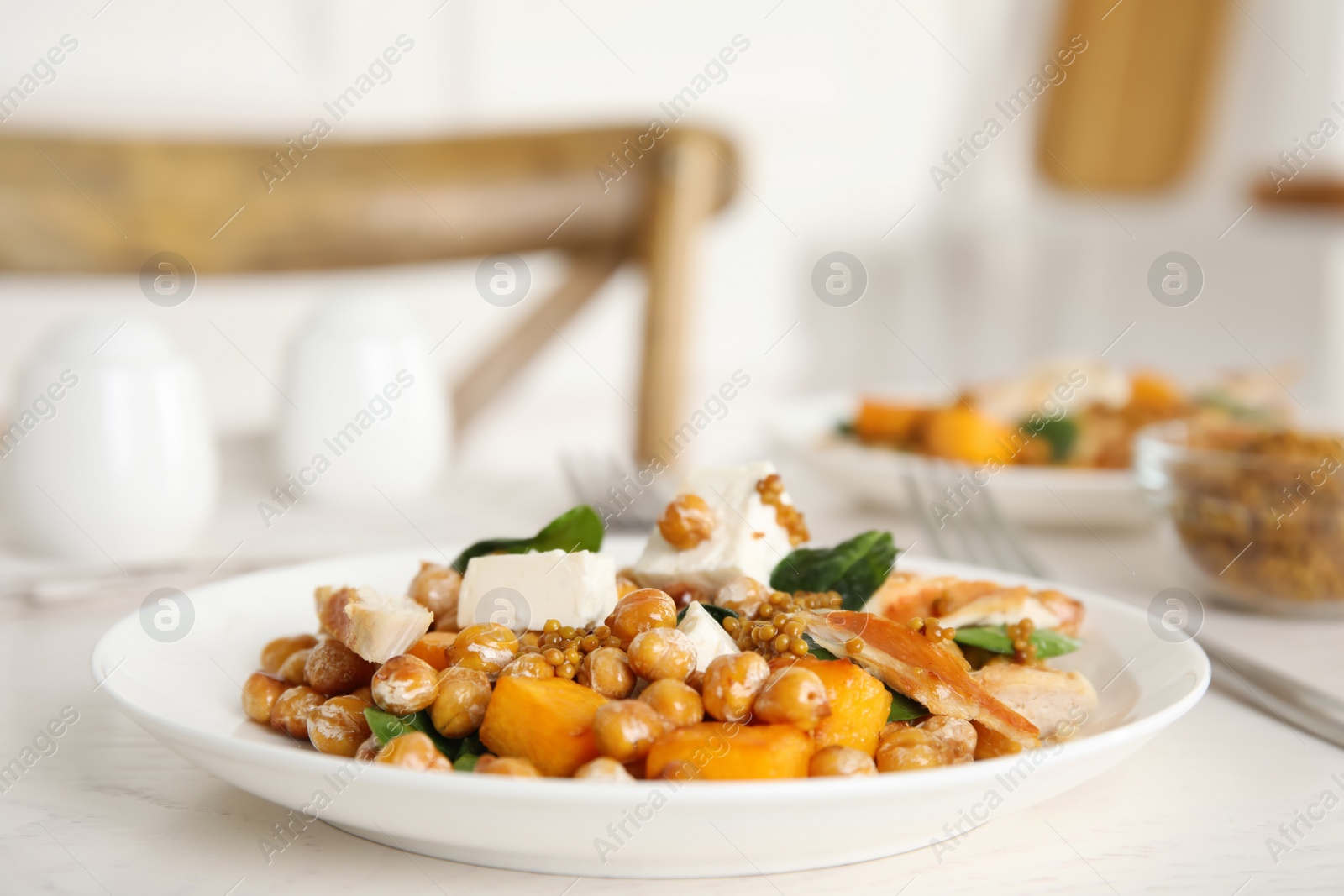 Photo of Delicious fresh chickpea salad on white wooden table