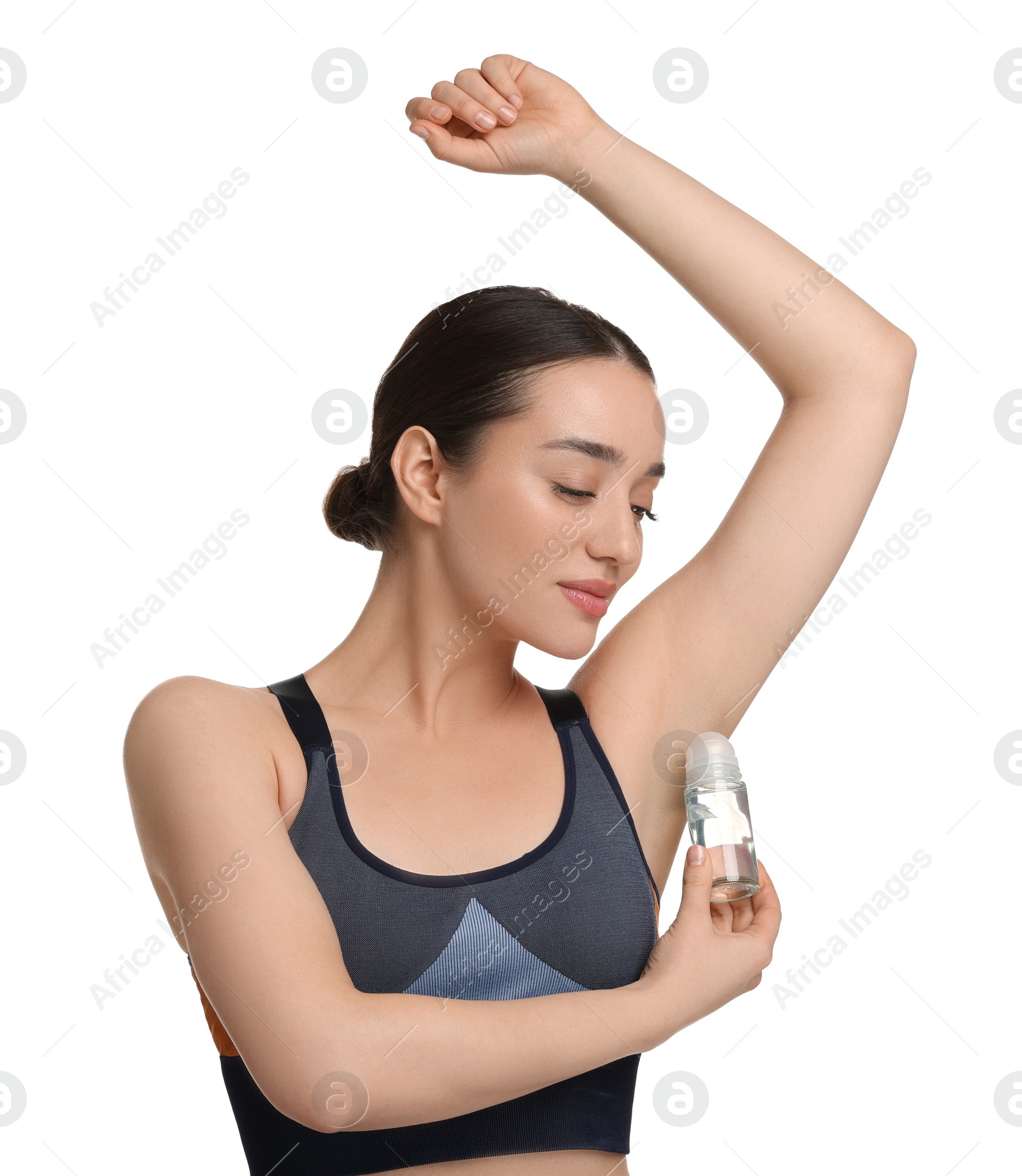 Photo of Beautiful woman applying deodorant on white background