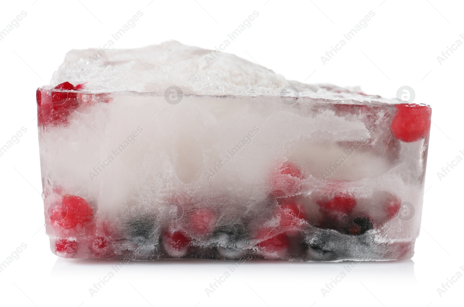 Photo of Raw berries frozen in ice cube on white background