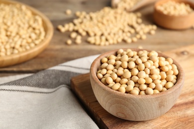 Photo of Natural organic soy beans on wooden table